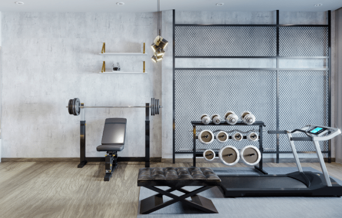 Palestra in casa con panca, bilanciere, manubri e tapis roulant